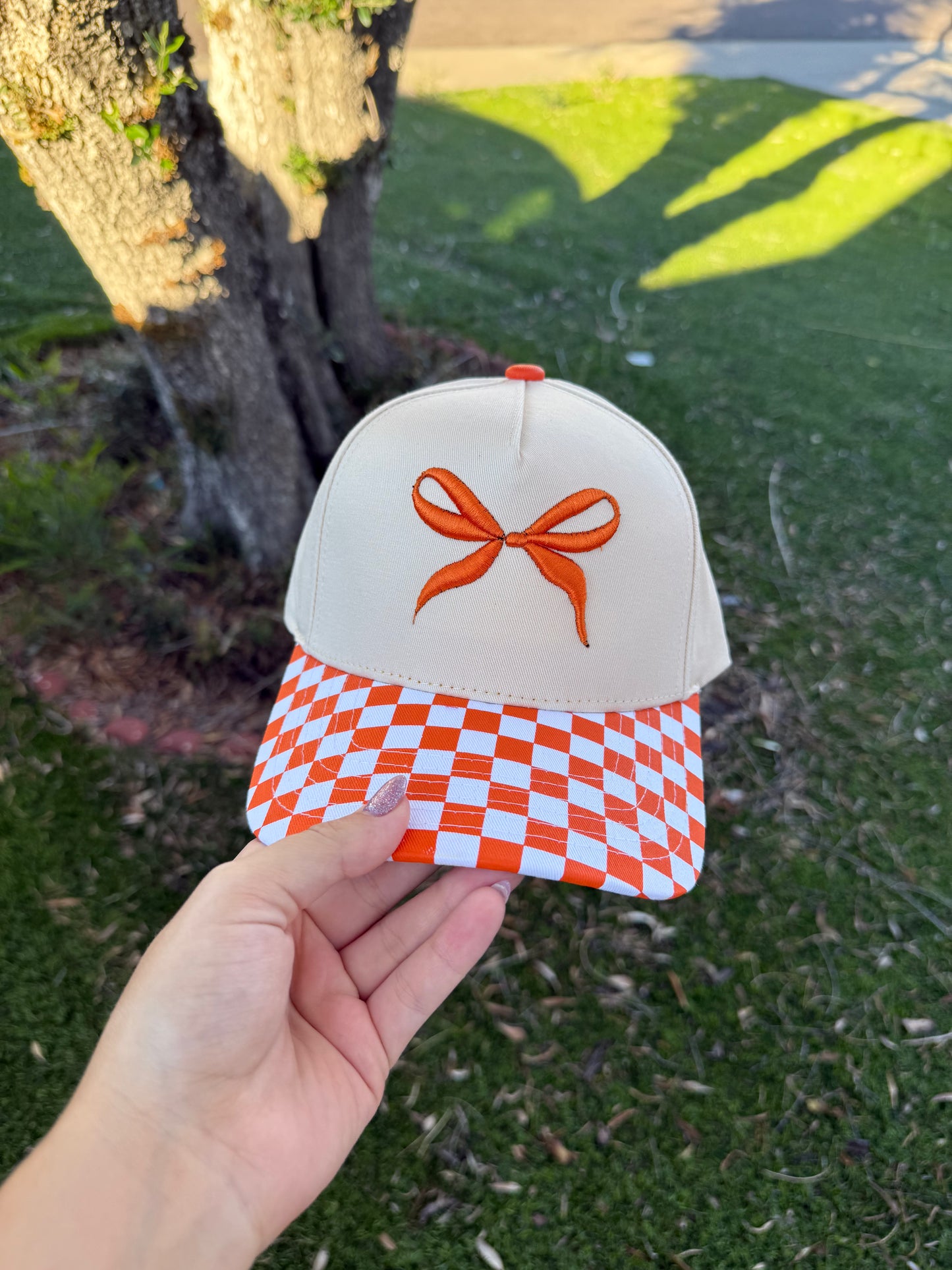 Orange bow trucker hat